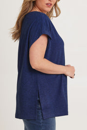 Model Chanel wearing size XL of the Bridget Top in colour Ocean (Blue), from the front, cropped image