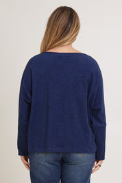 Model Chanel wearing size XL of the Pennie Long Sleeve Top in colour Ocean (Blue), from the back