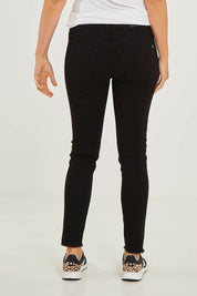 Model Georgia wearing size S of the Frayed Slim Fit Jean in colour Black (Black), from the back