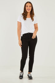 Model Georgia wearing size S of the Frayed Slim Fit Jean in colour Black (Black), from the front, showing the whole outfit