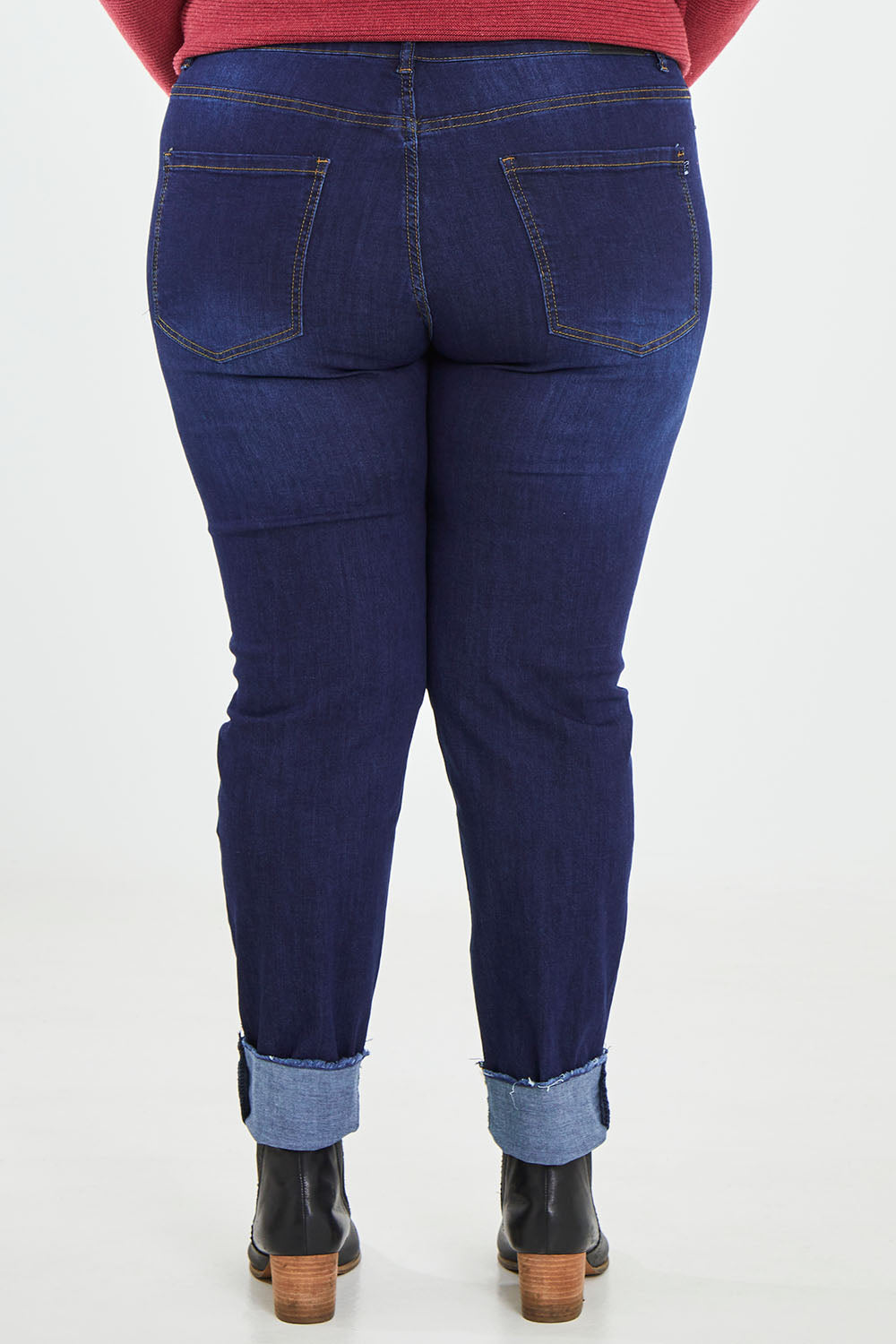 Model Caitlin wearing the Frayed Slim Fit Jean in colour Darkblue (Blue), from the back