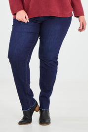Model Caitlin wearing the Frayed Slim Fit Jean in colour Darkblue (Blue), from the front, cropped image
