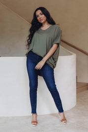 A model wearing the Frayed Slim Fit Jean in colour Darkblue (Blue), from the front, showing the whole outfit