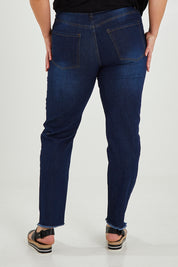 Model Maddy wearing size XXL of the Frayed Slim Fit Jean in colour Darkblue (Blue), from the back