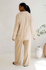 A model wearing the Gigi Lounge Pant in colour Portobeige, from the back