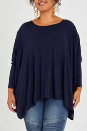 Model Alexis wearing size OneSize of the Long Sleeve Essential Top in colour Navy (Blue), from the front, cropped image