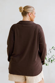 A model wearing the Gigi Lounge Sweater in colour Chocolate, from the back