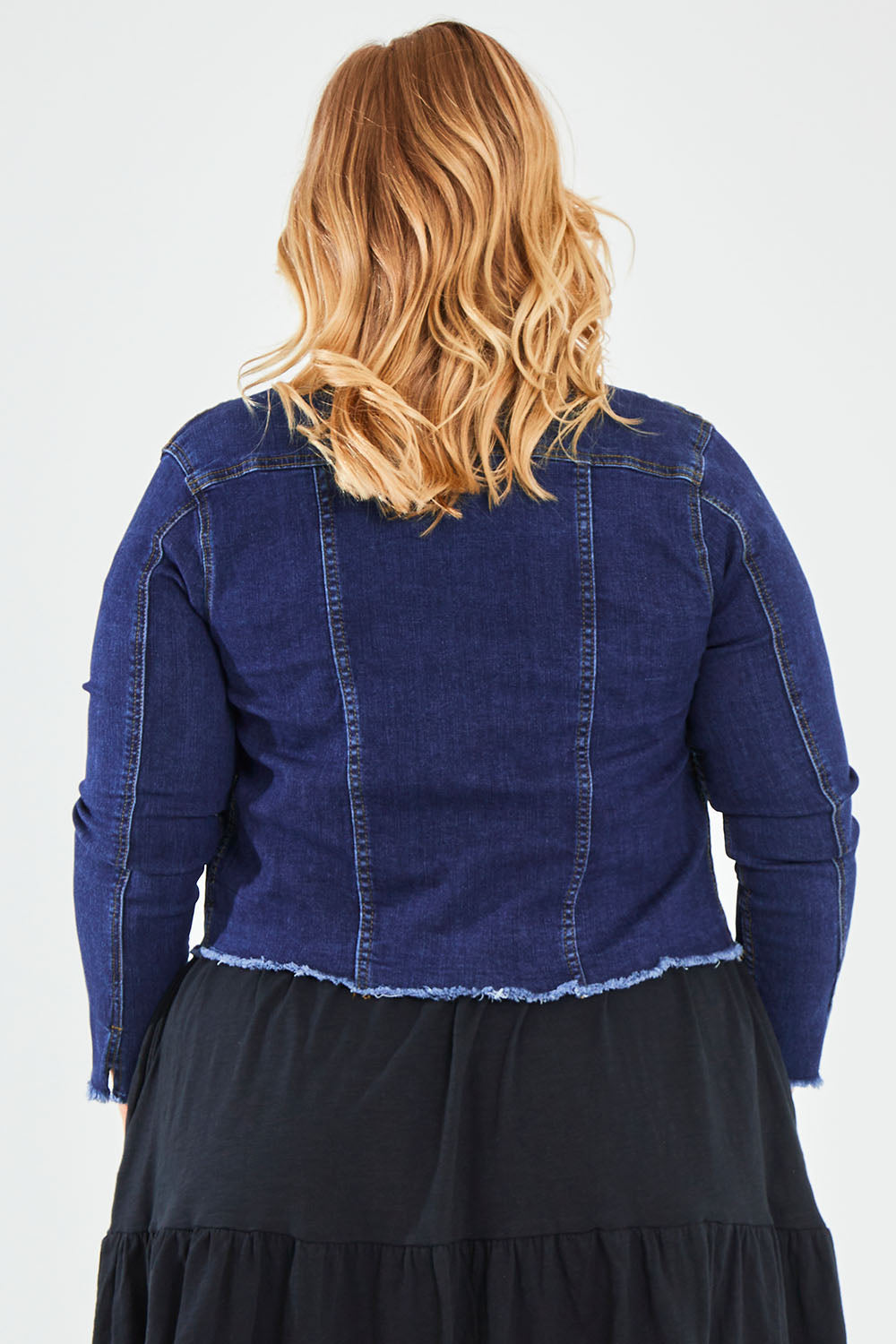 Model Caitlin wearing the Denim Jacket in colour Dkblue (Blue), from the back