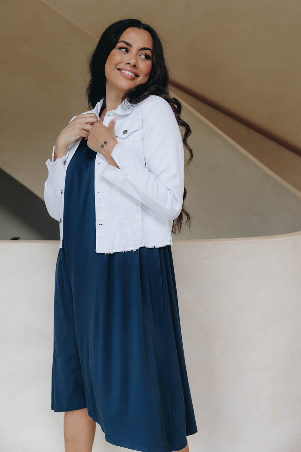 A model wearing the Denim Jacket in colour White (White), from the front, showing the whole outfit