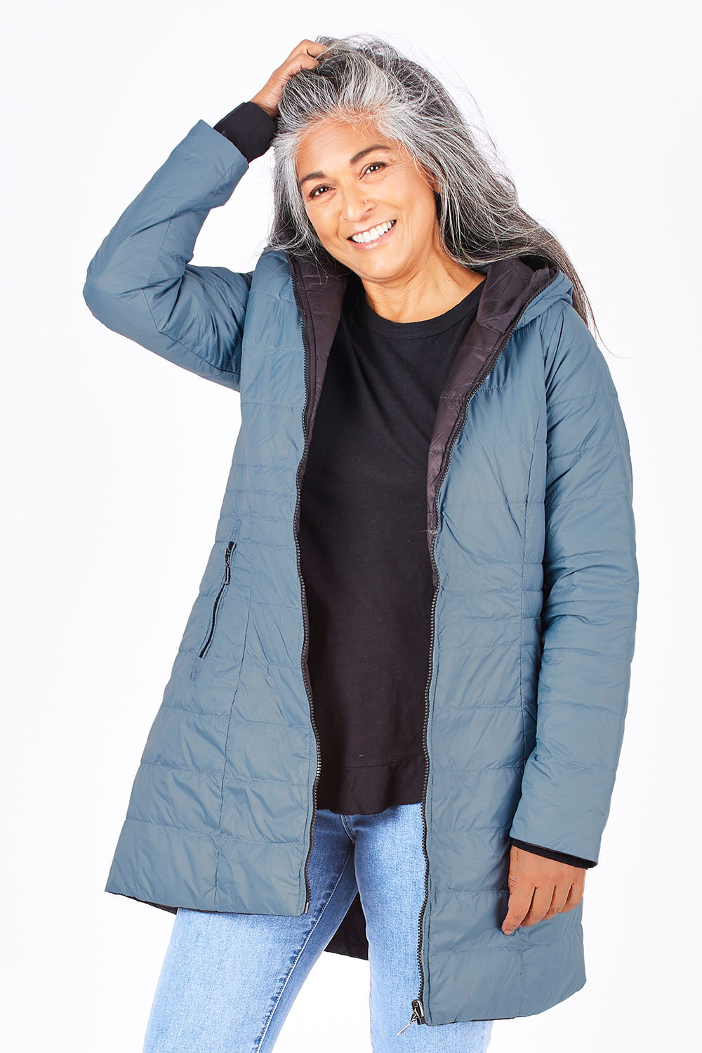 Model Nadine wearing size 10 of the Reversible Down Jacket in colour CharBlack (Grey), from the front, cropped image