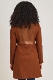 Model Ziara wearing size 10 of the Multi Fabric Jacket in colour Latte, from the back