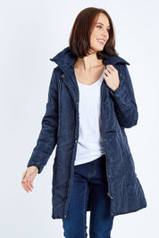 Model Andrea wearing size 10 of the Footy Jacket in colour Navy (Blue), from the front, cropped image