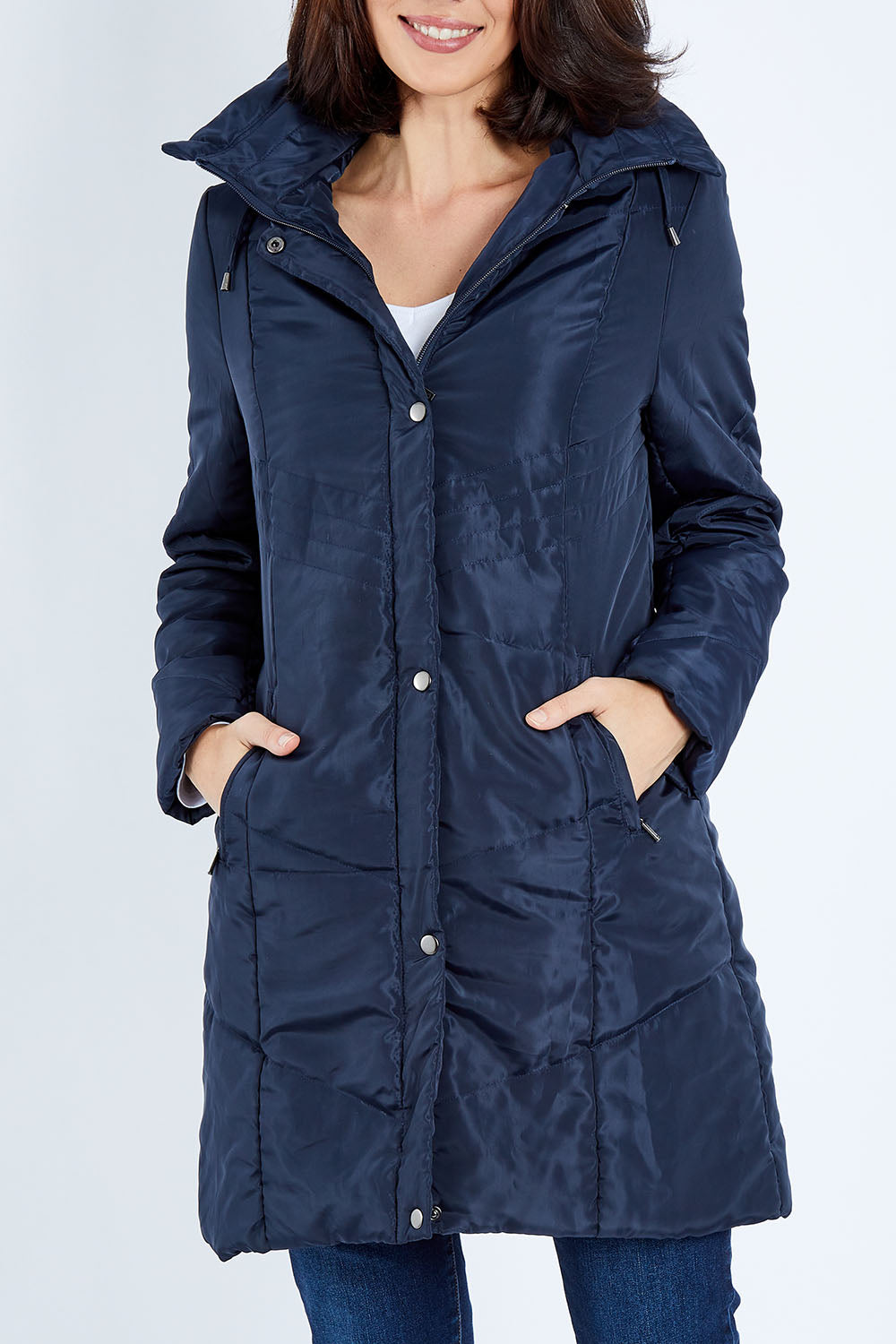 Model Andrea wearing size 10 of the Footy Jacket in colour Navy (Blue), from the front, cropped image