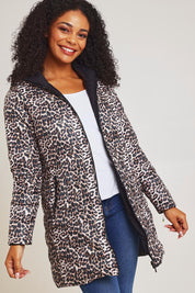 Model Ziara wearing size 10 of the 3/4 Reversible Down Jacket in colour Safari (Black), from the front, cropped image