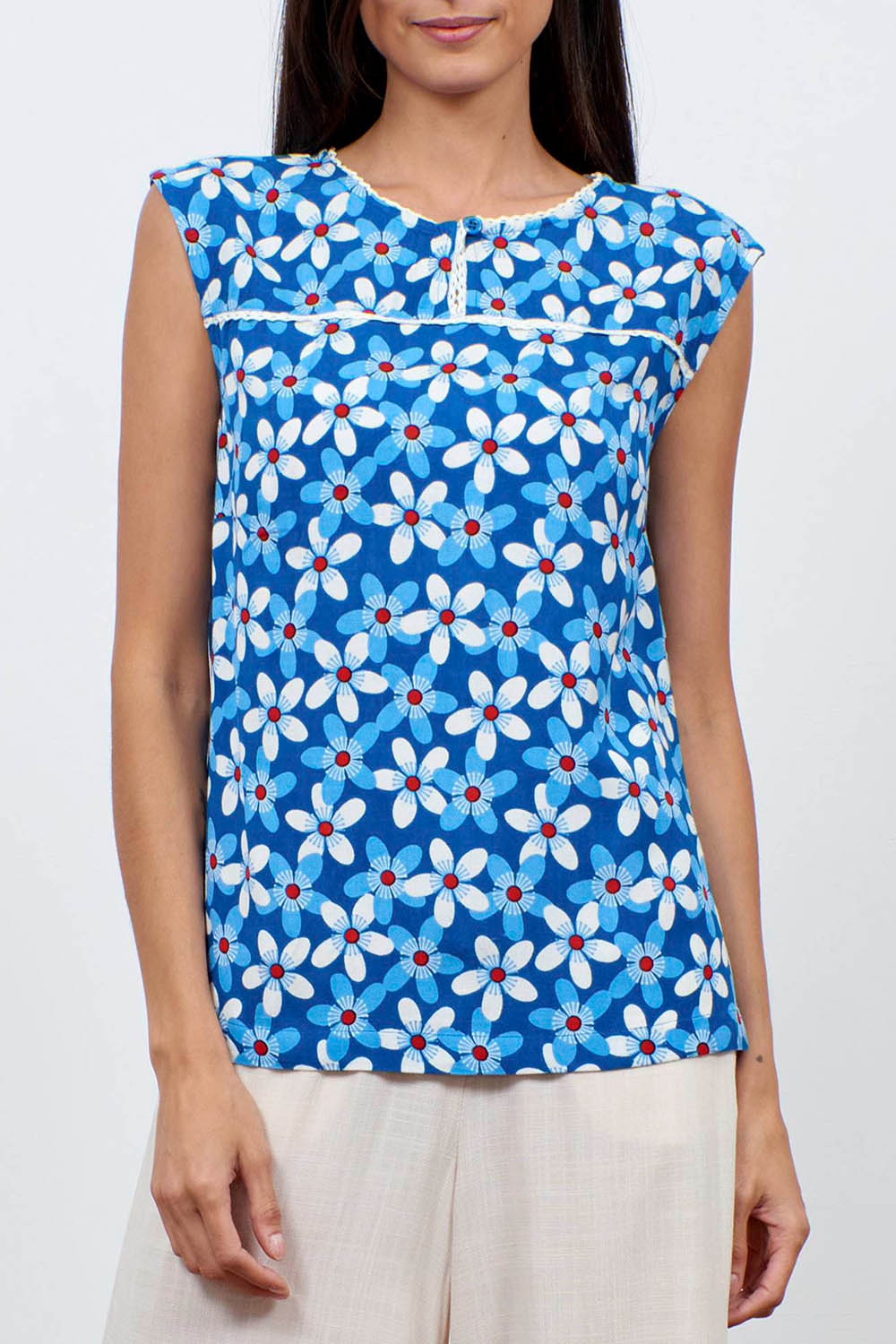 A model wearing the Helen Tank in colour Aster (Blue), from the front, cropped image