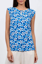 A model wearing the Helen Tank in colour Aster (Blue), from the front, cropped image