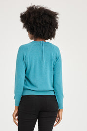 Model Aiyana wearing size 10 of the Susan Zip Back in colour Blue (Blue), from the back