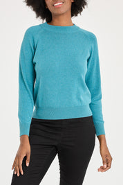 Model Aiyana wearing size 10 of the Susan Zip Back in colour Blue (Blue), from the front, cropped image