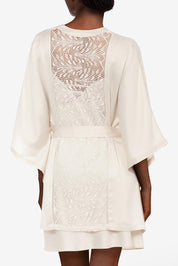 A model wearing Thelma Kimono in colour Talc, from the back