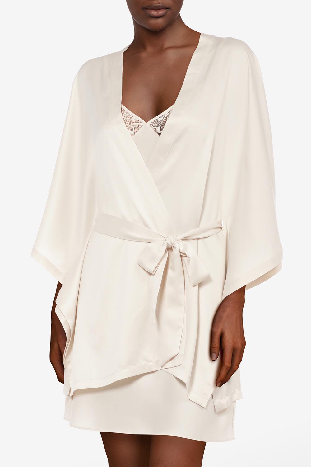 A model wearing Thelma Kimono in colour Talc, from the front, cropped image