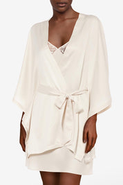 A model wearing Thelma Kimono in colour Talc, from the front, cropped image