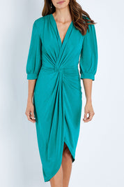 Model Amanda wearing size 10 of the Ocean Dress in colour Tealgreen (Green), from the front, cropped image