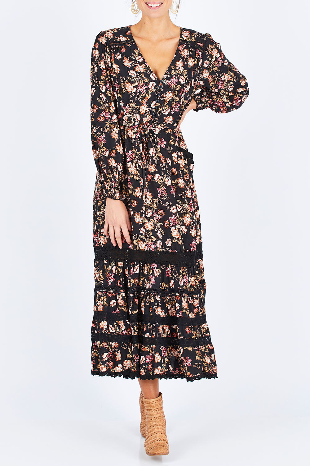 Model Madeline wearing size S of the Lela Maxi in colour Kimber (Black), from the front, cropped image