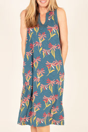 A model wearing the Stemmed Floral Beach Dress in colour Multi (Blue), from the front, cropped image