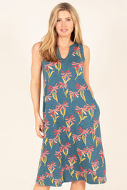 A model wearing the Stemmed Floral Beach Dress in colour Multi (Blue), from the front, cropped image
