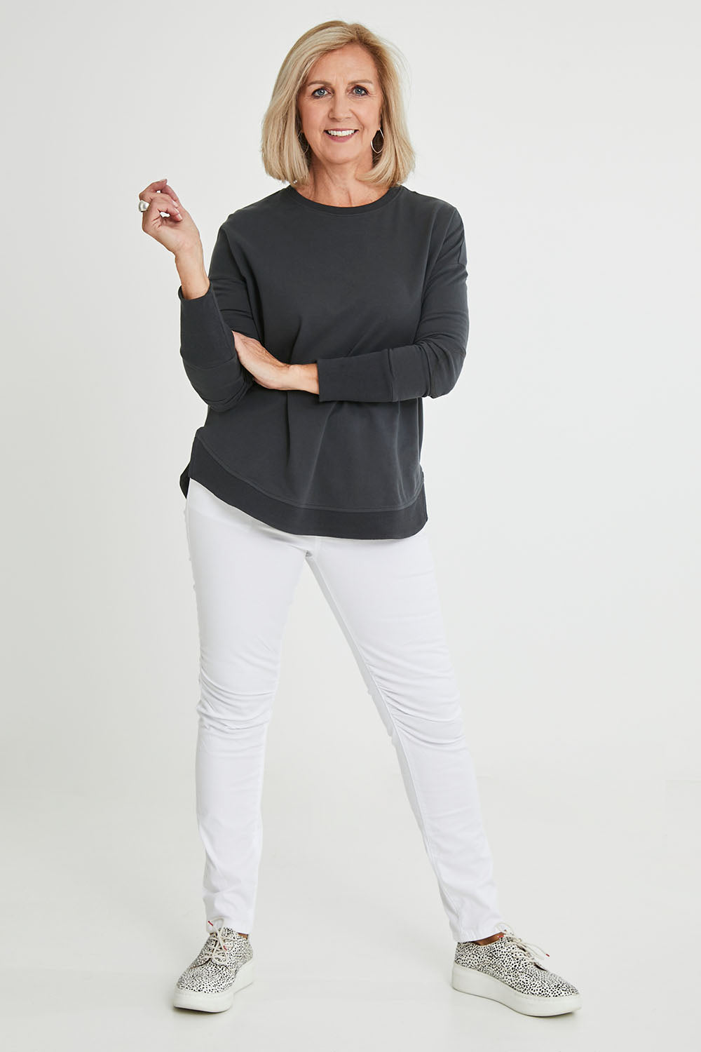 Model Sandy wearing size 10 of the Lucy French Terry Sweat in colour Gunmetal (Grey), from the front, showing the whole outfit