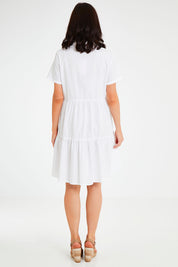 Model Andrea wearing size 10 of the Lori Dress in colour White (White), from the back