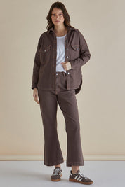 A model wearing the Fleur Bootleg Jean in colour Coco, from the front, showing the whole outfit
