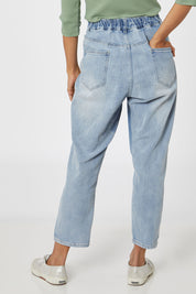 Model Cara wearing size 10 of the Isla Jean in colour Stoneblue (Blue), from the front, cropped image