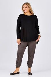 Model Ljubenka wearing size 18 of The Best Seller Pant in colour Castlerock (Green), from the front, showing the whole outfit