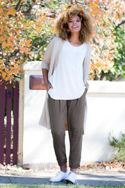 Model Summer wearing size 10 of The Best Seller Pant in colour Castlerock (Green), from the front, showing the whole outfit