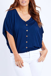 Model Laura wearing size 14 of The Relaxed Button Bamboo Tee in colour Navy (Blue), from the front, cropped image