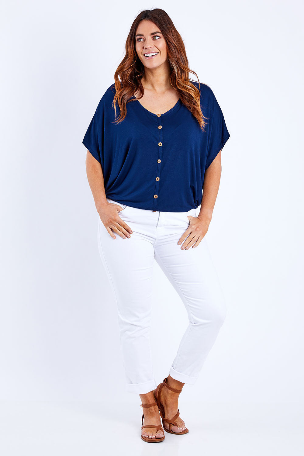Model Laura wearing size 14 of The Relaxed Button Bamboo Tee in colour Navy (Blue), from the front, showing the whole outfit