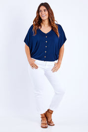 Model Laura wearing size 14 of The Relaxed Button Bamboo Tee in colour Navy (Blue), from the front, showing the whole outfit