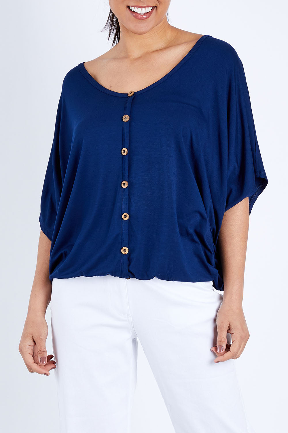 Model Pamela wearing size 10 of The Relaxed Button Bamboo Tee in colour Navy (Blue), from the front, cropped image