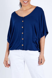 Model Pamela wearing size 10 of The Relaxed Button Bamboo Tee in colour Navy (Blue), from the front, cropped image