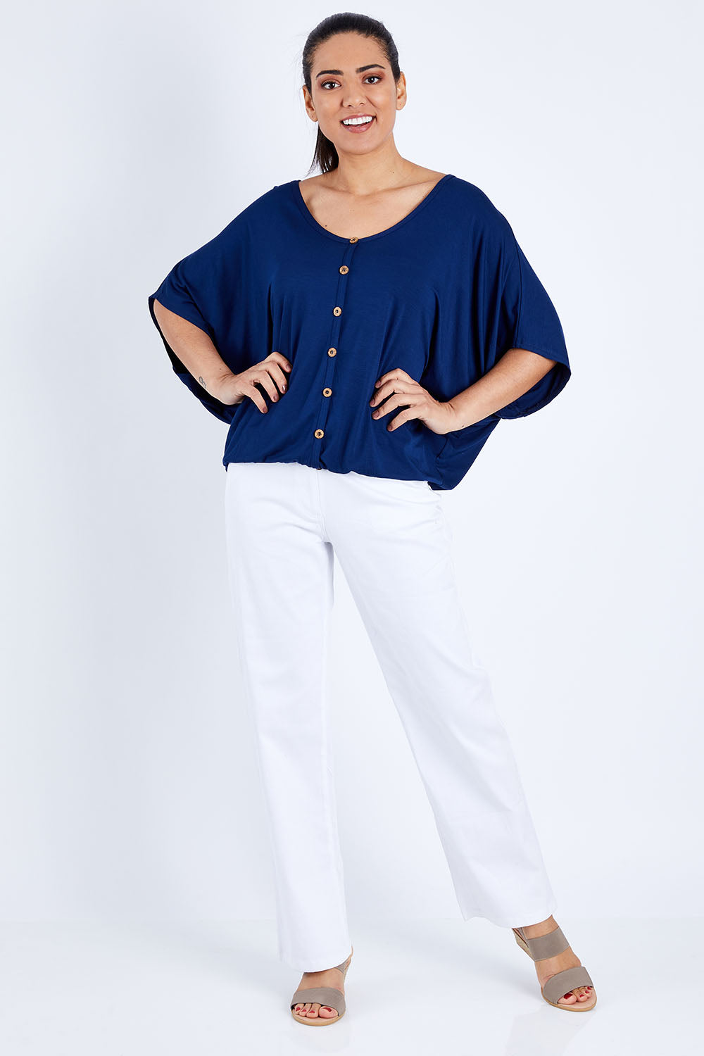 Model Pamela wearing size 10 of The Relaxed Button Bamboo Tee in colour Navy (Blue), from the front, showing the whole outfit