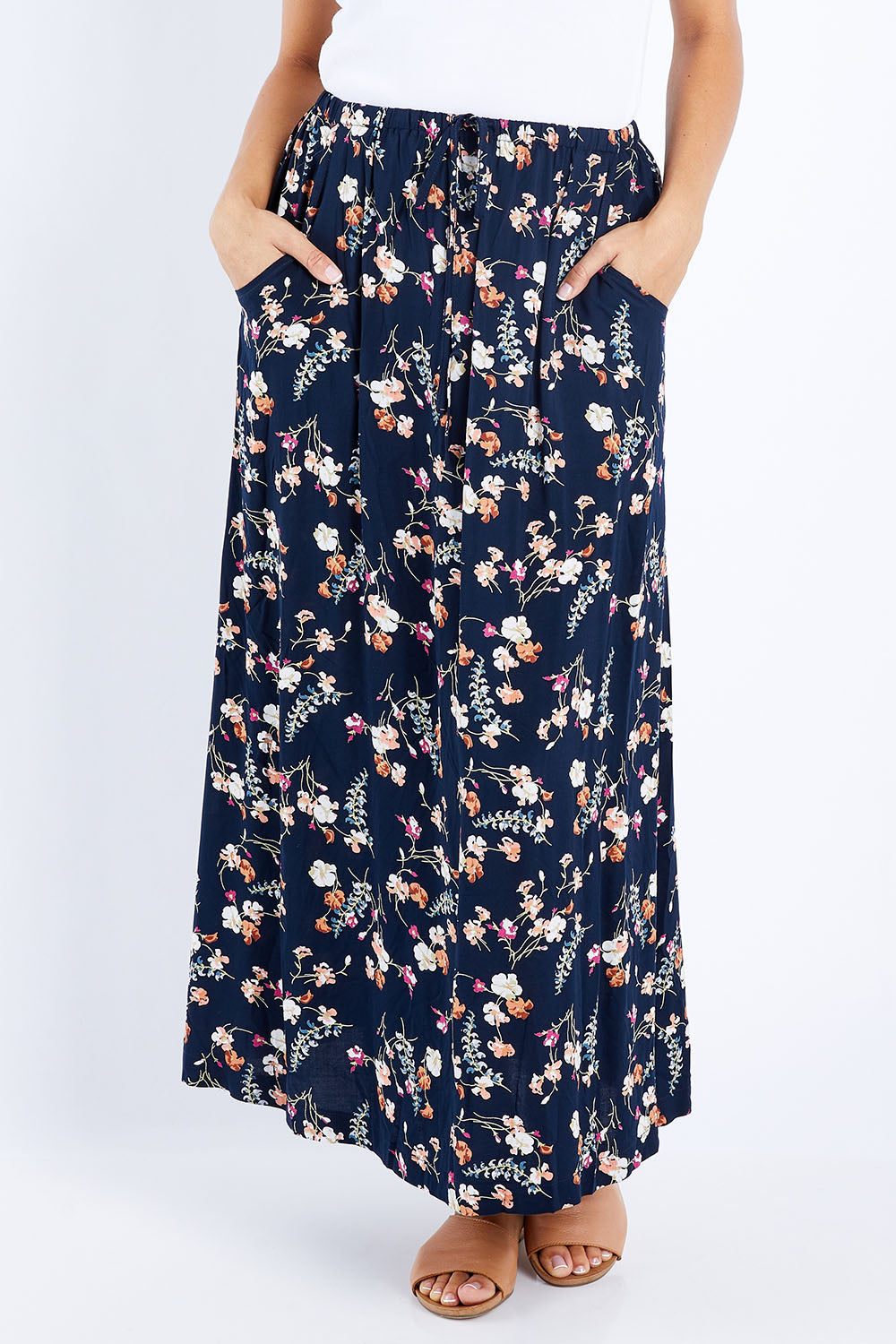 Model Lala wearing size 10 of The Drawstring Maxi Skirt in colour Fleur (Black), from the front, cropped image