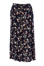 Product shot of The Drawstring Maxi Skirt in colour Fleur (Black), from the front