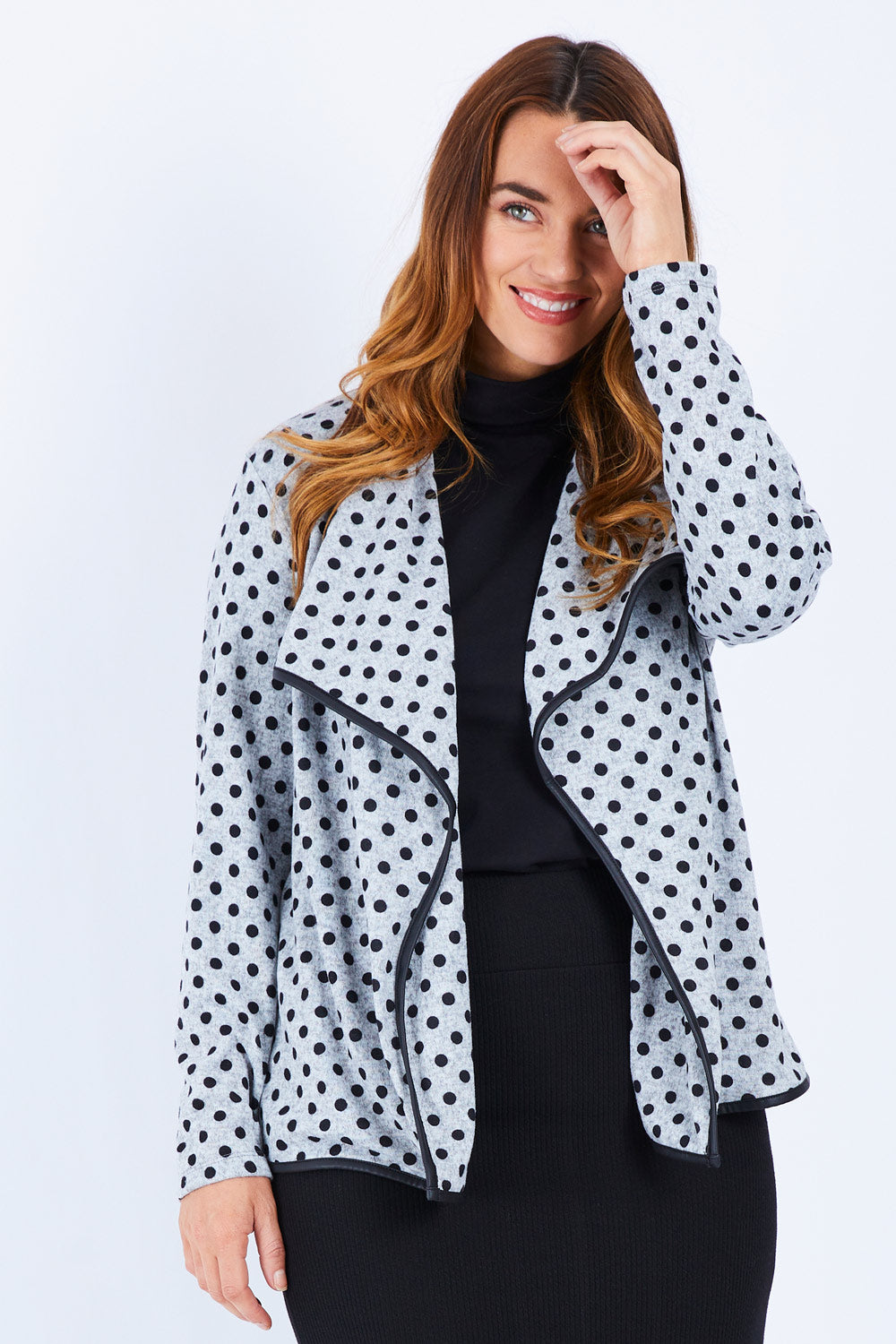 Model Laura wearing size 14 of The Free Fall Midi Cardi in colour Greyspot (Grey), from the front, cropped image