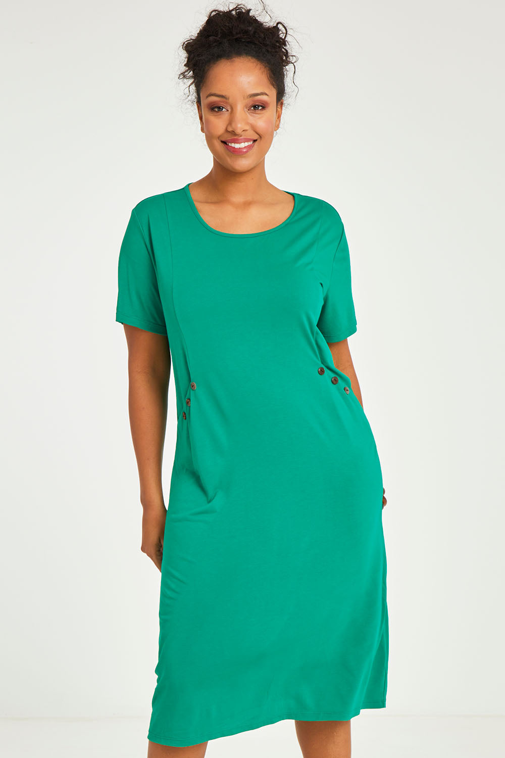 Model Noli wearing size 14 of The Bamboo Blend Button Dress in colour Jade (Green), from the front, cropped image