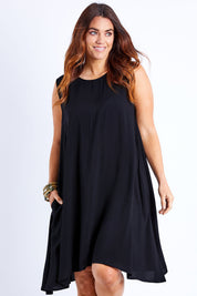 Model Laura wearing size 14 of The Essential Shift Dress in colour Black (Black), from the front, cropped image