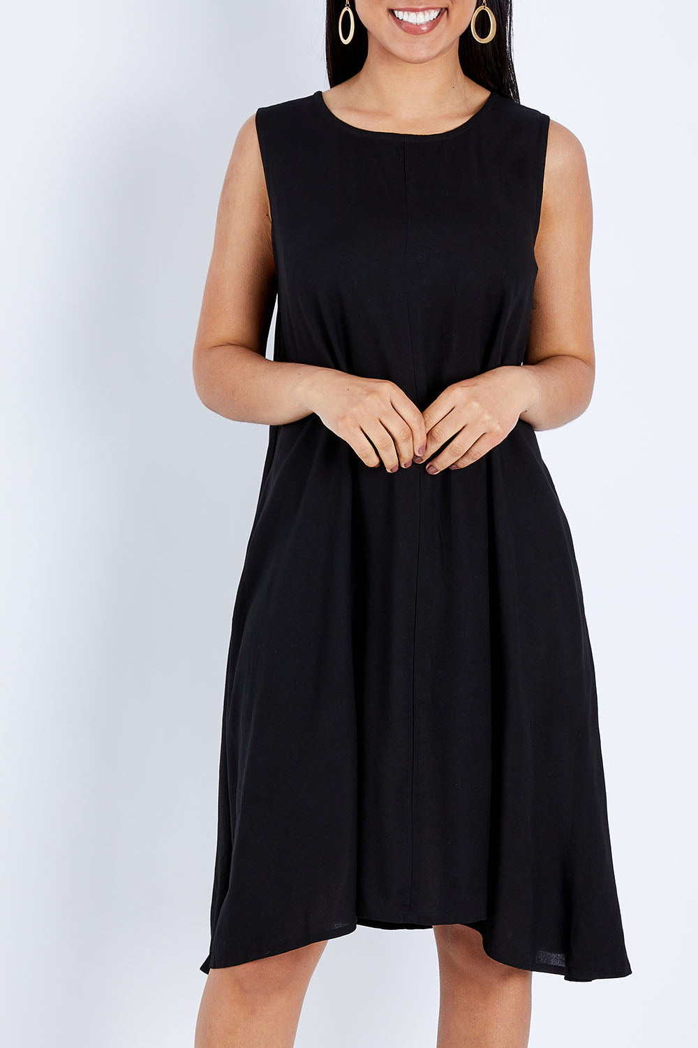 Model Pamela wearing size 10 of The Essential Shift Dress in colour Black (Black), from the front, cropped image