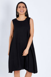 Model Pamela wearing size 10 of The Essential Shift Dress in colour Black (Black), from the front, cropped image
