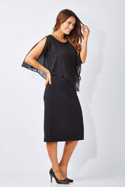 Model Laura wearing size 12 of The Overlay Midi Dress in colour Black (Black), from the front, showing the whole outfit
