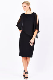 Model Maddy wearing size 10 of The Overlay Midi Dress in colour Black (Black), from the front, showing the whole outfit